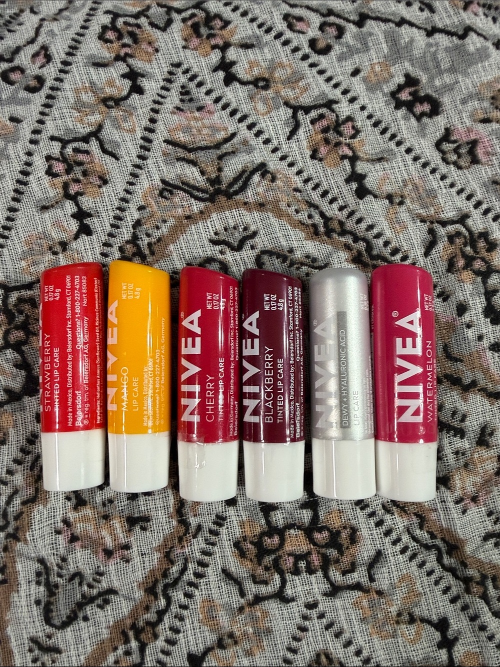 Nivea Tinted Lip Balm:  Watermelon, Strawberry, Cherry and Blackberry are tinted